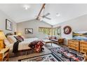 Comfortable bedroom featuring vaulted ceilings, wooden accents, soft rug, and bright natural light at 387 Moonstone Rd, Breckenridge, CO 80424