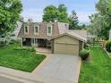 Charming two-story home with manicured lawn and attached two car garage at 6359 S Locust Way, Centennial, CO 80111
