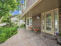 Inviting front porch with brick accents and cozy seating area at 6359 S Locust Way, Centennial, CO 80111