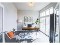 Bright office space with large windows, modern decor, and hardwood floors at 1345 W 67Th Pl, Denver, CO 80221