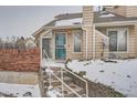 Townhouse entrance with stairs and a security gate at 2121 S Troy Way, Aurora, CO 80014