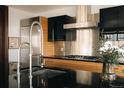 Bright kitchen featuring stainless appliances, black countertops and a modern faucet at 1133 14Th St # 1820, Denver, CO 80202
