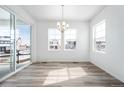 Inviting dining area with large windows, offering a lovely view and ample natural light at 39720 Congress Ln, Elizabeth, CO 80107