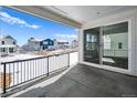 Covered patio that provides a great view of neighboring houses and community at 39720 Congress Ln, Elizabeth, CO 80107