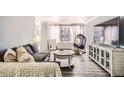 Bright living room with sleek hardwood floors, stylish seating, and ample natural light at 789 N Clarkson St # 705, Denver, CO 80218