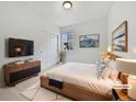 Cozy main bedroom with natural light, a modern dresser, and neutral decor at 12742 E 104Th Dr, Commerce City, CO 80022