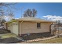 Detached brick garage with two doors and walkway at 2525 S Ivanhoe Pl, Denver, CO 80222