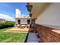 Inviting front porch featuring a seating area and hanging plants at 11883 W Marlowe Pl, Morrison, CO 80465