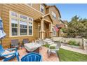 Inviting front porch featuring a brick patio with comfortable seating and a view of the neighborhood at 3668 Pecos Trl, Castle Rock, CO 80109