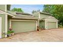Charming townhome with a two-car garage and a well-manicured front yard, ready for its new owners at 2840 S Kenton Ct, Aurora, CO 80014