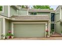 Charming townhome with a two-car garage and a well-manicured front yard, ready for its new owners at 2840 S Kenton Ct, Aurora, CO 80014