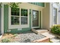 Inviting front entryway featuring stone ground cover and attractive exterior paint at 10814 Bayfield Way, Parker, CO 80138