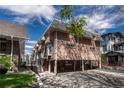 Unique brick apartment building with covered parking and mature landscaping at 1355 Gaylord St # 6, Denver, CO 80206