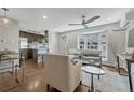 Open-concept living space connects to a modern kitchen with a breakfast bar at 1355 Gaylord St # 6, Denver, CO 80206