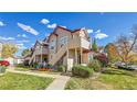 Attractive multi-level condo building with charming exterior details and well-maintained landscaping at 8371 S Upham Way # 208, Littleton, CO 80128