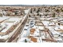 Aerial view of a residential street, showing houses covered in snow at 13390 W 8Th Ave, Lakewood, CO 80401