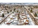 Aerial view of suburban neighborhood with snow-covered homes at 13390 W 8Th Ave, Lakewood, CO 80401