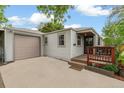 Charming single-story home with well-maintained lawn, driveway and garage with inviting front porch at 4285 Newland St, Wheat Ridge, CO 80033