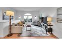 Bright living room features a large window, comfortable seating, and modern decor at 1858 S Cole St, Lakewood, CO 80228