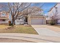 Charming two-story home featuring a stone-accented facade, well-kept lawn, and an attached two-car garage at 10532 Wintersweet Ct, Parker, CO 80134