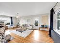 Bright and spacious living room with hardwood floors and stone fireplace at 9128 Hillview Rd, Morrison, CO 80465