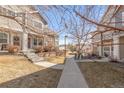 Townhome complex showcasing manicured lawns and architectural design at 12814 Jasmine St # C, Thornton, CO 80602