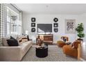 Modern living room with a neutral color palette and stylish decor at 948 Andrews Crest Dr, Berthoud, CO 80513