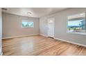 Bright living room with hardwood floors and two windows at 4804 N Raleigh St, Denver, CO 80212