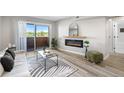 Inviting living room with electric fireplace, balcony access, and adjacent bathroom entrance at 4274 S Salida Way # 3, Aurora, CO 80013