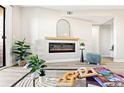 Cozy living room with sleek electric fireplace, complemented by stylish decor and natural light at 4274 S Salida Way # 3, Aurora, CO 80013