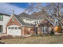 Charming brick home featuring a two-car garage, and an inviting front entrance at 366 Elm St, Denver, CO 80220