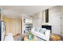 Cozy living room featuring a fireplace, comfortable sofa, and stylish decor at 8701 Huron St # 1-207, Thornton, CO 80260