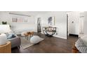Inviting living room featuring hardwood floors and stylish contemporary furnishings at 7625 Turner Dr, Denver, CO 80221