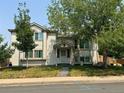 Two-story home with a landscaped yard and attached garage at 4316 N Malta St, Denver, CO 80249