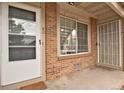 Close up of the entrance, featuring a front door and a large window at 195 S Sable Blvd # U12, Aurora, CO 80012