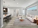 Bright living space with an open floor plan, sleek finishes and modern decor at 1245 Utica St # 104, Denver, CO 80204