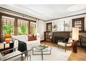 Cozy living room with hardwood floors, fireplace, and a comfortable seating arrangement at 843 Adams St, Denver, CO 80206