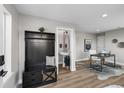 Hall tree with bench seating and coat hooks, transitioning to bathroom and office area at 2140 S Ash St # 101, Denver, CO 80222