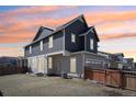 A spacious backyard featuring a well-maintained lawn and a wood fence surrounding the property at 21411 E 60Th Ave, Aurora, CO 80019