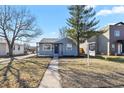 Charming single-story home with a well-maintained front yard and 'For Sale' sign at 4729 N Meade St, Denver, CO 80211