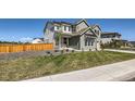 Charming front yard with well-maintained lawn and attractive landscaping at 6255 Kenzie Cir, Castle Pines, CO 80108