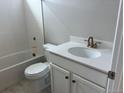 Bright bathroom with a white vanity, modern fixtures, and a combined bathtub and shower at 1713 Jennifer St, Brighton, CO 80601