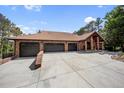 A spacious home with a tile roof and a three-car garage and generous driveway at 12570 W 60Th Ave, Arvada, CO 80004