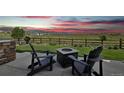 Relaxing backyard with fire pit and mountain views, perfect for outdoor entertaining at 8803 Antero Ct, Arvada, CO 80007