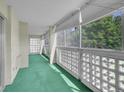 Enclosed balcony with green carpet and great natural light at 3144 S Wheeling Way # 206, Aurora, CO 80014