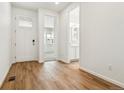 Bright entryway with wood-look floors, leading to other rooms in the house at 39171 Anthony St, Elizabeth, CO 80107