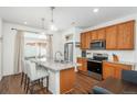 Bright, modern kitchen with granite countertops, stainless steel appliances, and a center island at 4431 N Quatar Ct, Aurora, CO 80019