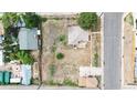 Aerial shot showcases the home's positioning on a large lot next to a neighboring street at 598 S Navajo St, Denver, CO 80223