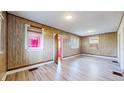 Open living room features bright wood floors and a large window at 598 S Navajo St, Denver, CO 80223