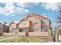 Beautiful townhouse with unique siding, stone accents, and well-maintained landscaping at 23505 E Platte Dr # 8D, Aurora, CO 80016